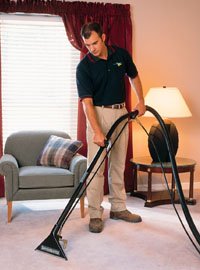 Technician Performing Carpet and Upholstery Cleaning